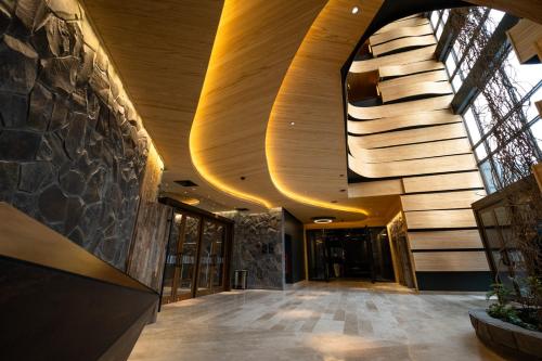a hallway of a building with a wooden ceiling at Hotel Termas Chillán in Nevados de Chillan