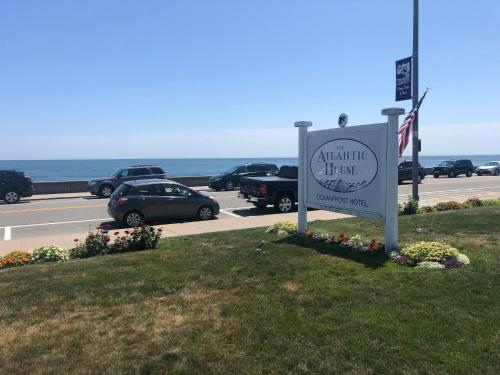 a sign for a hotel next to a parking lot at The Atlantic House in Narragansett