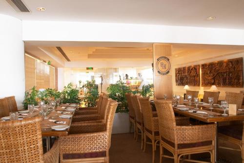 a restaurant with a long table and chairs in it at Royal Beach Eilat by Isrotel Exclusive in Eilat