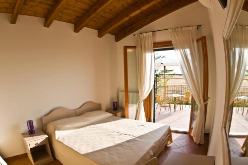 Postel nebo postele na pokoji v ubytování Agriturismo Fiumi Uniti