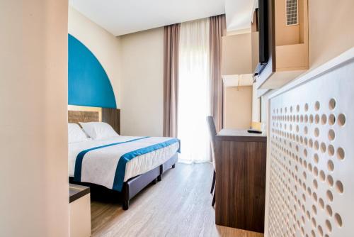 a hotel room with a bed and a tv at San Lorenzo - Boutique Hotel & SPA in Lettere