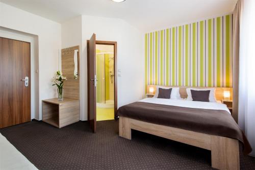 Postel nebo postele na pokoji v ubytování Hotel Bon