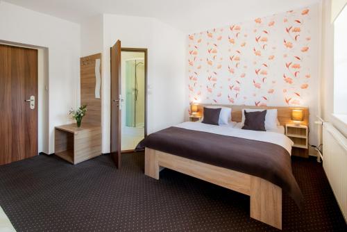 Postel nebo postele na pokoji v ubytování Hotel Bon
