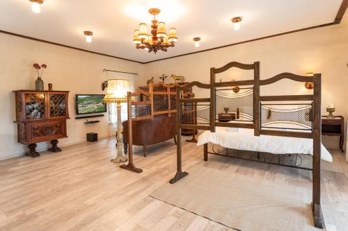 a bedroom with two bunk beds and a chandelier at Historic Apartment in the heart of the City in Veliko Tŭrnovo