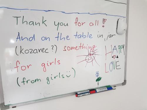 a whiteboard with a handwritten thank you for all and on the table in her at Apartment Dolce Vita in Celje