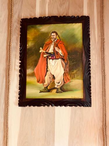 a painting of a man hanging on a wall at Готельно-ресторанний комплекс «Галицький замок» in Ternopilʼ