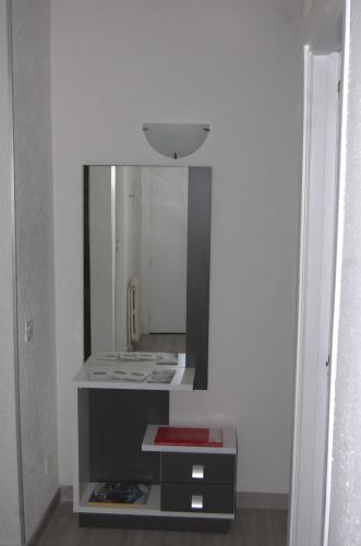a bathroom with a mirror and a sink at PASSAMANÉ 19 - Canillo - Casco Antiguo Hut 7867 in Canillo