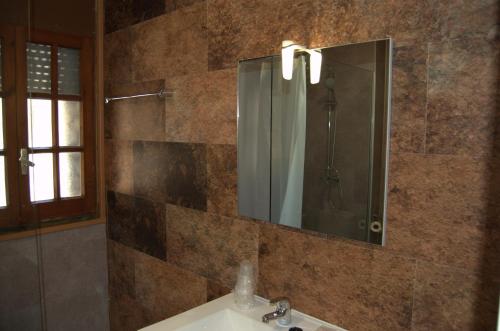 a bathroom with a sink and a mirror at PASSAMANÉ 19 - Canillo - Casco Antiguo Hut 7867 in Canillo
