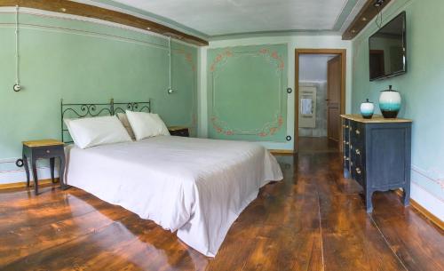 Ένα ή περισσότερα κρεβάτια σε δωμάτιο στο Ca’d’ambra