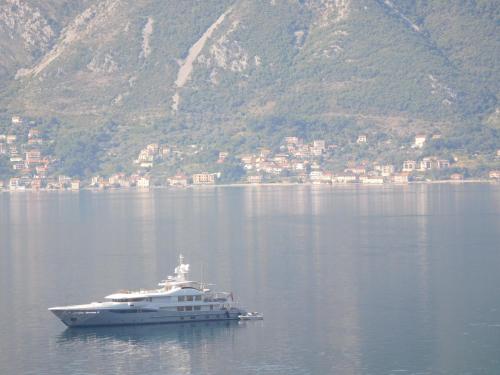 a yacht in the middle of a large body of water at Villa Aronija in Kotor