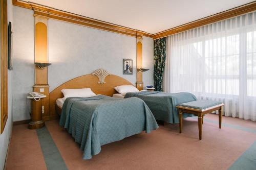 Ένα ή περισσότερα κρεβάτια σε δωμάτιο στο Landhaus Keller - Hotel & Restaurant