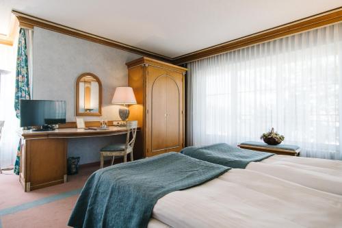 Ένα ή περισσότερα κρεβάτια σε δωμάτιο στο Landhaus Keller - Hotel & Restaurant