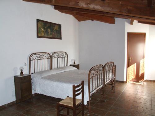 Ліжко або ліжка в номері Antico Frantoio
