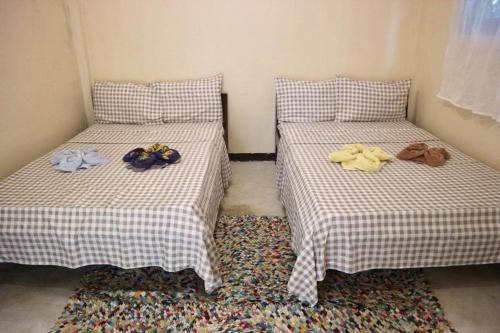 Postel nebo postele na pokoji v ubytování Maharlika siargao 2 pax
