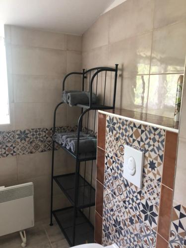 a bunk bed in a room with a wall at Villa Casa Mia in Balatonlelle