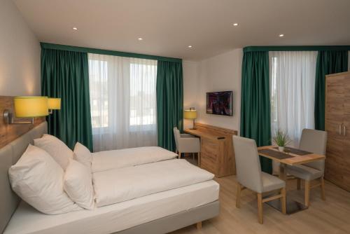 a living room with a white couch and a table at Apartment Düsseldorf Nord in Düsseldorf