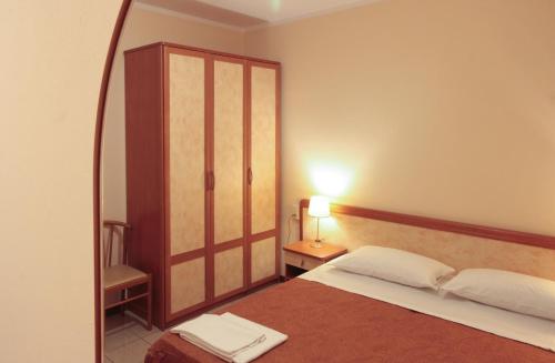 Postel nebo postele na pokoji v ubytování Hotel Rose&Crown