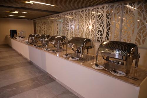 a row of barber chairs lined up on a counter at PrideInn Plaza Nairobi Airport in Nairobi