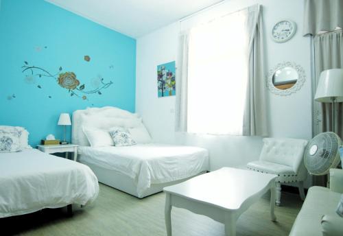 Katil atau katil-katil dalam bilik di Tainan Travel Inn - ChengGong Univ.