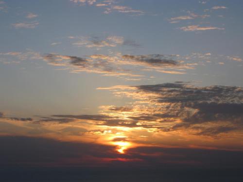 a cloudy sky with the sun in the middle at Hotel Edelweiss in Erice