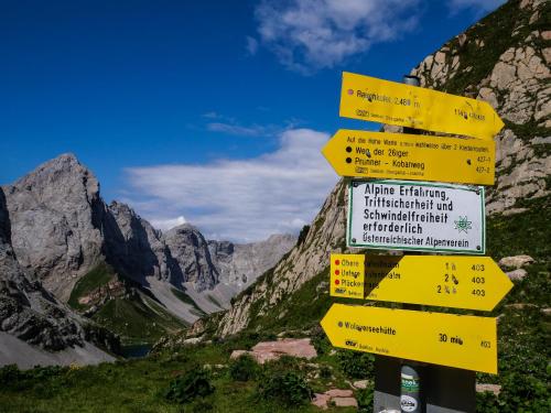 a group of yellow signs with mountains in the background at Ferienhaus Mautzfried in Reisach