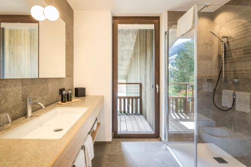 a bathroom with a shower and a sink at Pra Palmer The Green B&B in Ortisei