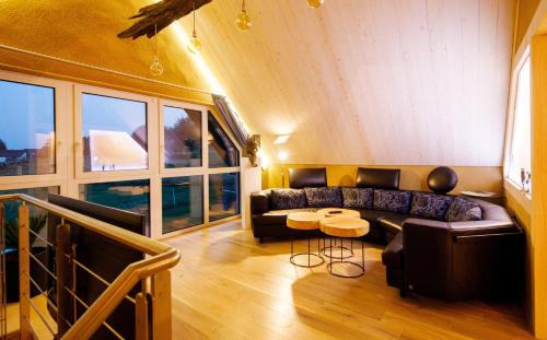 a living room with a couch and a table at Blaues Haus in Monschau
