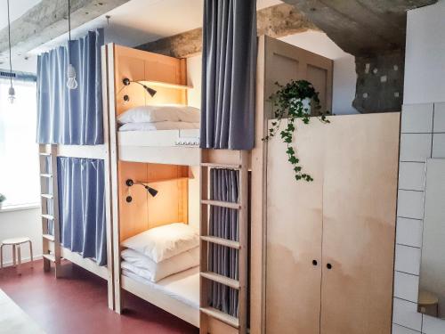 a room with bunk beds in it at CMYK Ústí nad Labem in Ústí nad Labem
