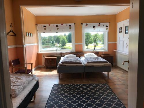 Кровать или кровати в номере Fegens Vandrarhem