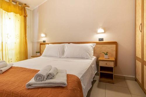 Cama ou camas em um quarto em Hotel Oasi del Mare