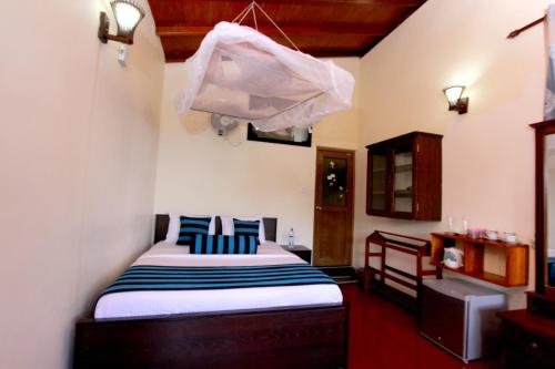Postel nebo postele na pokoji v ubytování Blue Ribbon Homestay