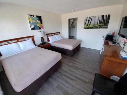 Postel nebo postele na pokoji v ubytování Value Lodge Motel