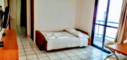 Hotel Jangada Flatにあるベッド