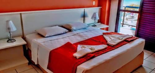 Hotel Jangada Flatにあるベッド