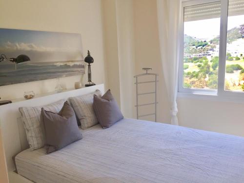 A bed or beds in a room at Valle Romano golf resort Capitolio Estepona