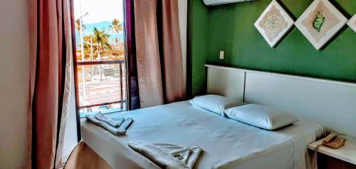 Hotel Jangada Flatにあるベッド