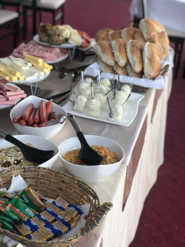 a buffet of bread and pastries on a table at Complex Praga in Gorno Lakočerej
