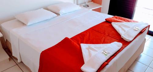 Hotel Jangada Flatにあるベッド