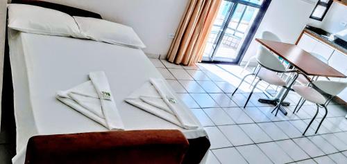 Hotel Jangada Flatにあるベッド