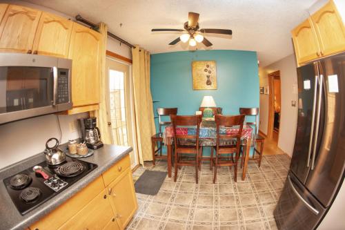 a kitchen with a table and a dining room at Tiga Bed and Breakfast in Yellowknife