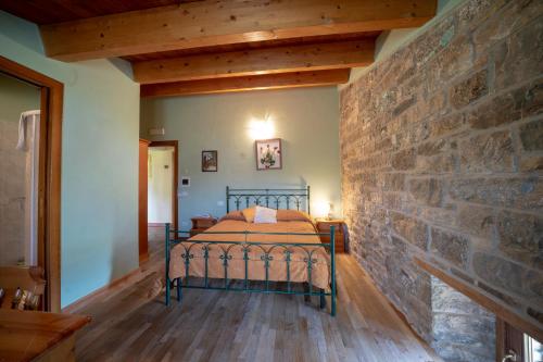 Ένα ή περισσότερα κρεβάτια σε δωμάτιο στο Agriturismo La Ginestra