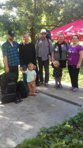 a group of people posing for a picture at Marina's guest house in Lentekhi