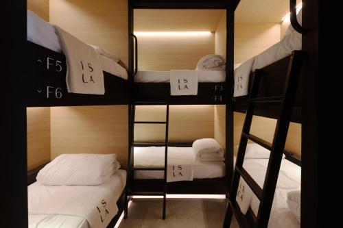 a group of bunk beds in a room at ISLA Tel Aviv in Tel Aviv