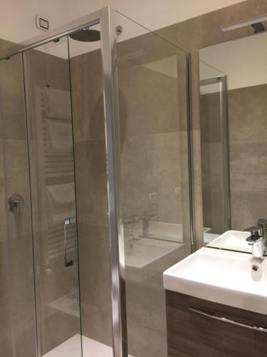 a bathroom with a shower and a sink at Uma Apartments in Venice