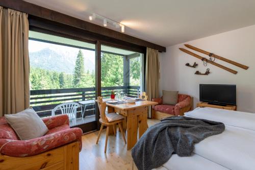 Postel nebo postele na pokoji v ubytování Zuhause in den Alpen Ihre Ferienwohnung mit Hallenbad und Sauna