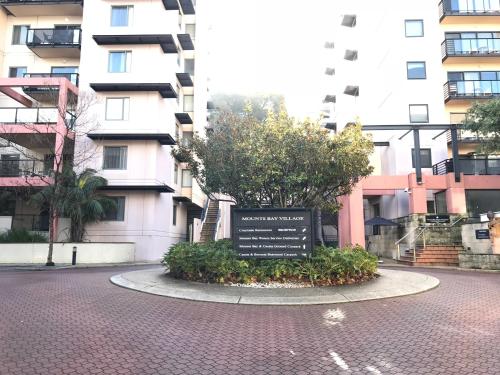 a sign in the middle of a street in front of a building at Eliza's Lookout in Perth