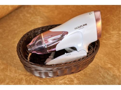 a hair dryer is sitting in a basket at One's Hotel Fukuoka in Fukuoka