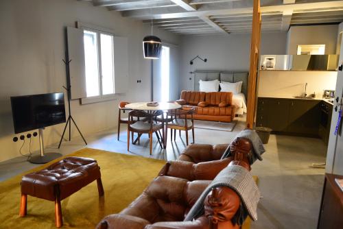 a living room with a couch and a table at Raw Culture Art & Lofts Bairro Alto in Lisbon