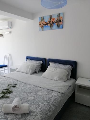 Кровать или кровати в номере Apartments Natali