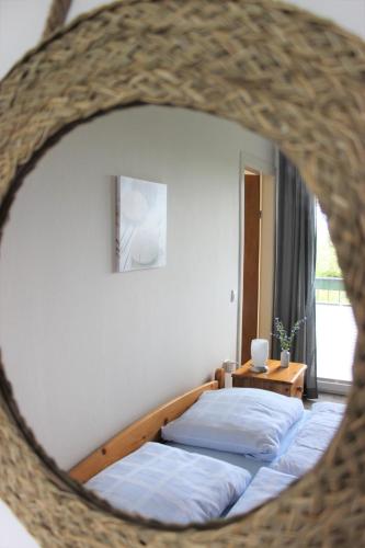 a bedroom with two beds and a table at Hotel Gasthuus Spieskamer in Hasselberg